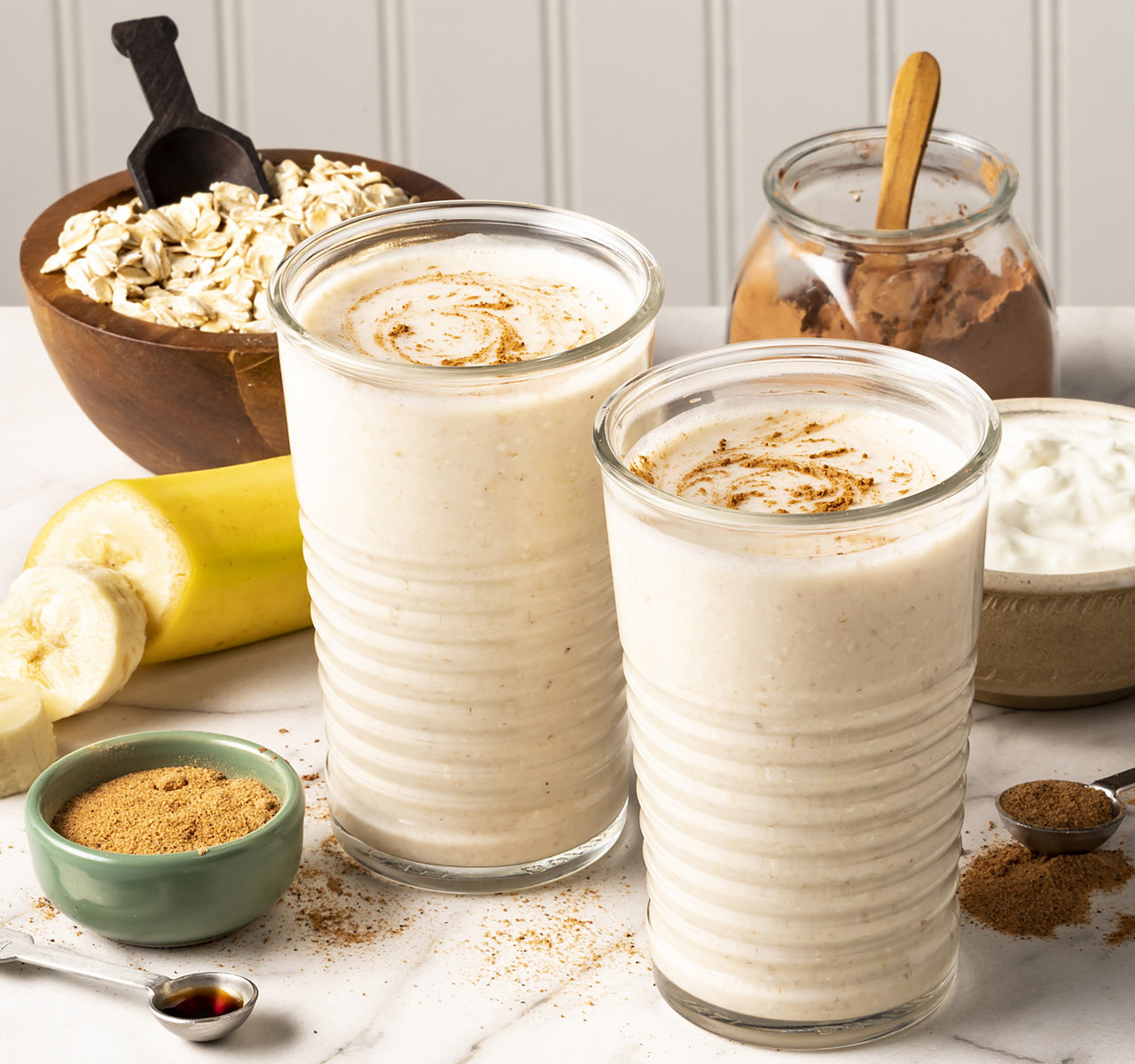 two banana bread smoothies in glasses