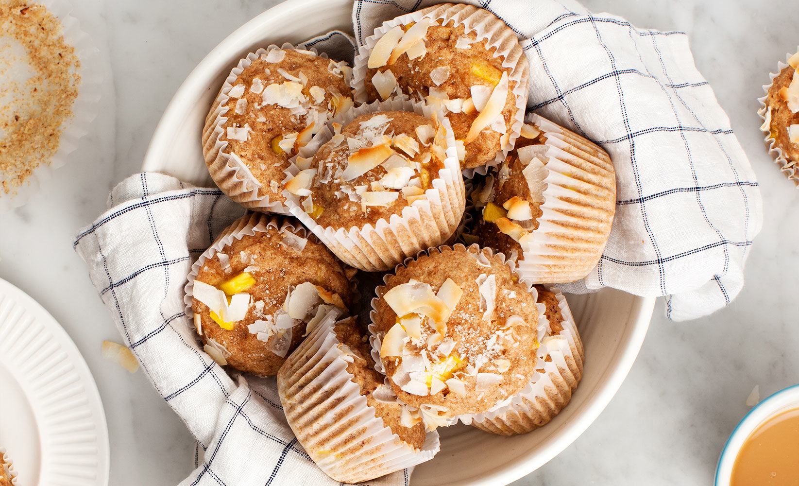 bowl of coconut mango muffins