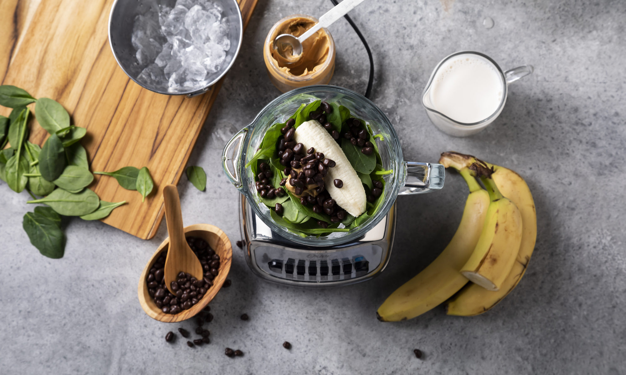overhead view of banana cacao green smoothie ingredients
