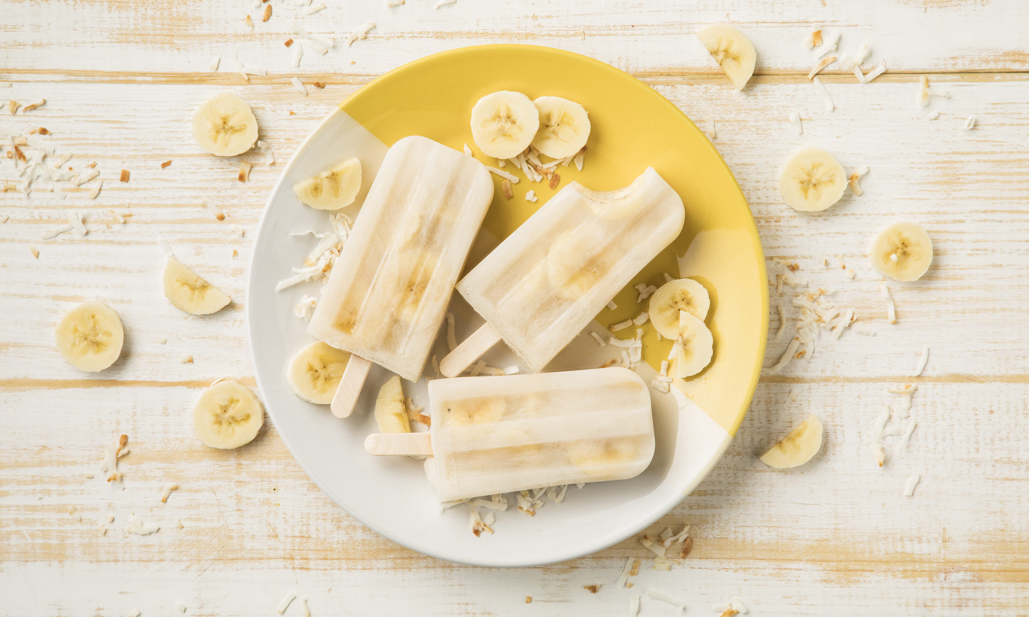 Three Banana Popsicles on a Plate
