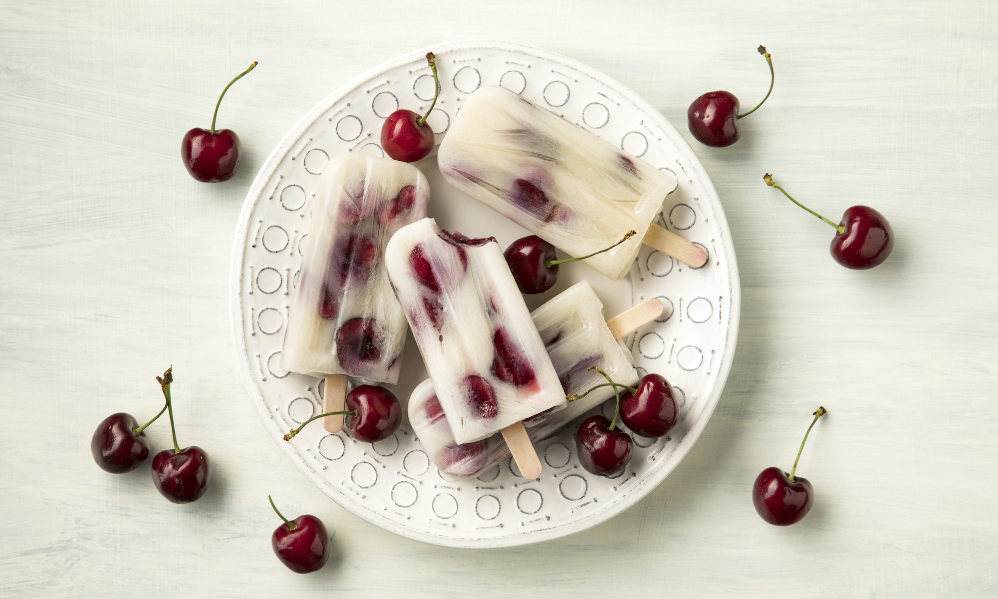 plate of cherry popsicles